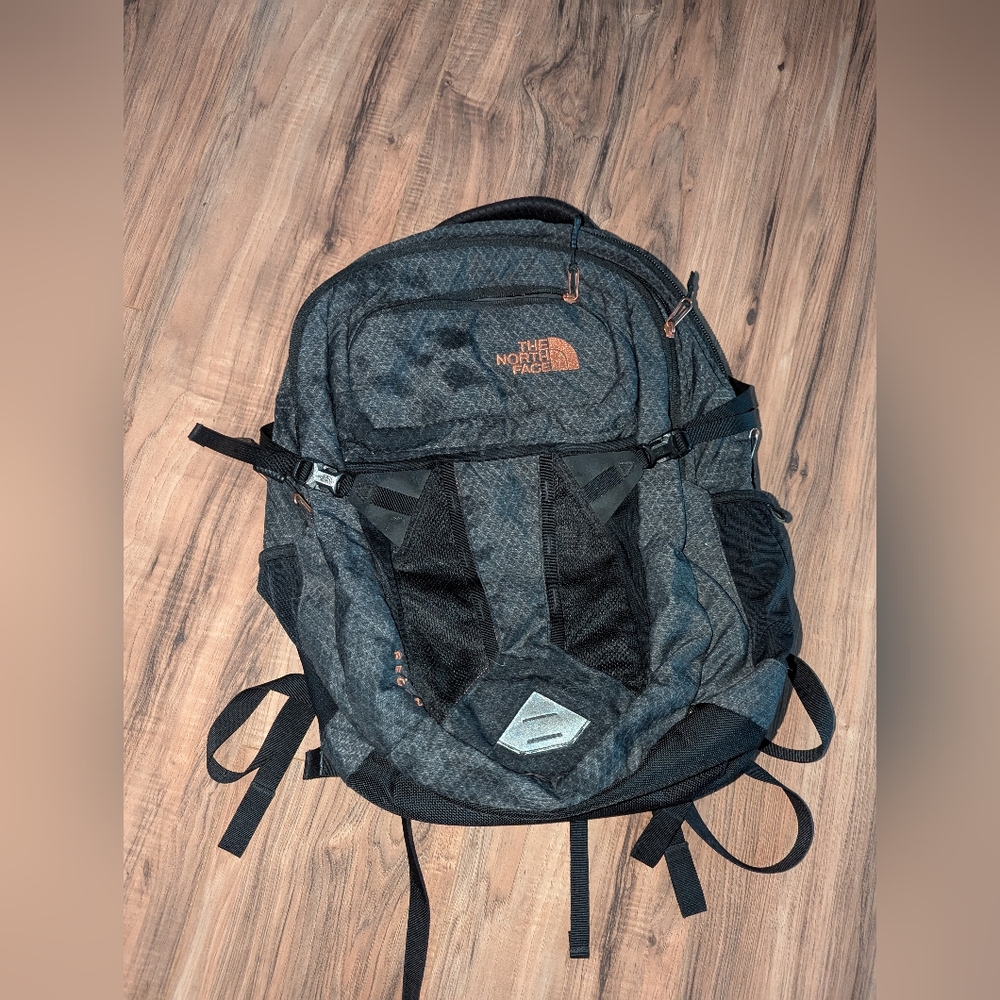 The North Face Black And Metallic Recon Backpack With Laptop Sleeve.